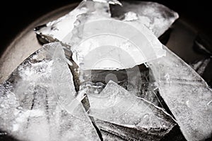Pieces of crushed ice on black background