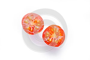 Pieces of cut fresh tomatoes isolated on white background