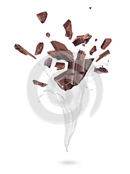Pieces of dark chocolate with milk splashes on a white background