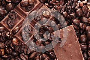Pieces of dark chokolate and coffee beans