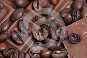 Pieces of dark chokolate and coffee beans