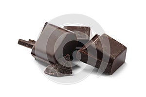 Pieces of delicious dark chocolate isolated