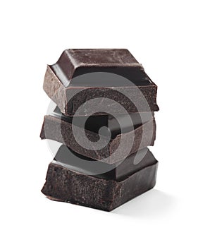 Pieces of delicious dark chocolate isolated