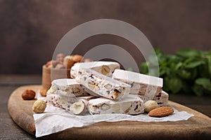 Pieces of delicious nutty nougat on board