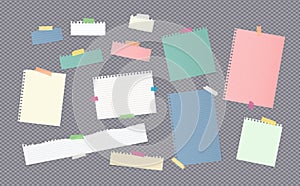 Pieces of different size colorful note, notebook, copybook paper sheets stuck with sticky tape on gray background