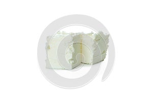 Pieces of feta cheese isolated on white background