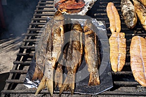 The pieces of fish are being grilled.