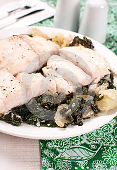 Pieces of fish fillet with green bok choy