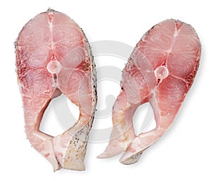 Pieces of fish portioned on a white background, isolated. Top view