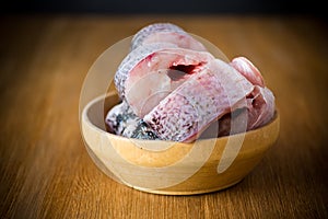 Pieces of fresh raw pike fish in a bowl