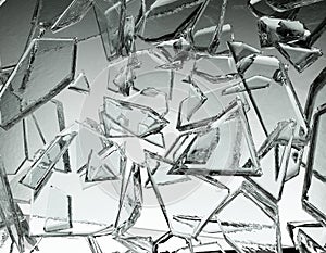 Pieces of glass broken or cracked on grey