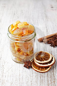 Pieces of candied orange peel coated in sugar in jar