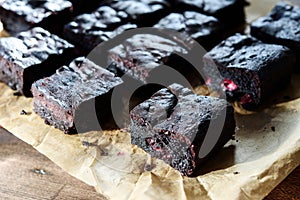 Pieces of homemade chocolate brownie with cherries