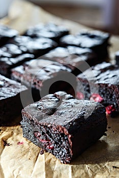 Pieces of homemade chocolate brownie with cherries