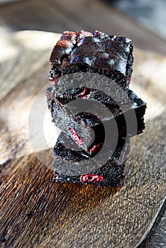 Pieces of homemade chocolate brownie with cherries