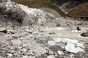 Pieces of ice fall from the Fox Glacier, New Zealand, South Island