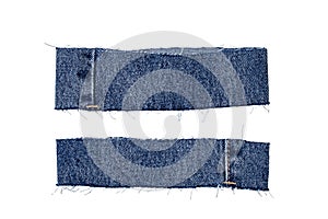 Pieces of jeans fabric with fringe isolated on white background. Two cut-off pant leg pieces of a blue denim jeans. Macro
