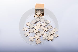 Pieces of jigsaw puzzle out of box as problem solution concept