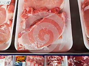 Pieces of juicy beef fillet packed in film are sold on a meat counter at a major grocery shopping centre