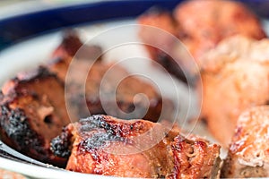 Pieces of kebab removed from skewers and put on a plate