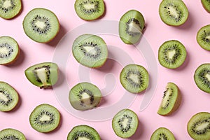 Pieces of kiwis on pink background