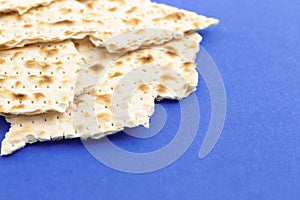 Pieces of Matzah Bread Unleavened Bread on a Blue Background