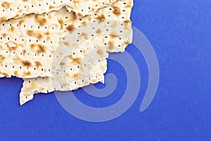 Pieces of Matzah Bread Unleavened Bread on a Blue Background