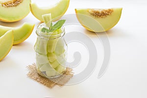 Pieces of melon in a jar.