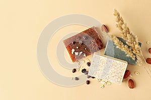 Pieces of natural handmade soap on beige background