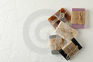 Pieces of natural handmade soap on white background