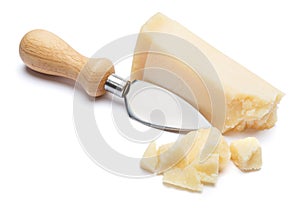 Pieces of Parmesan cheese and knife on white background