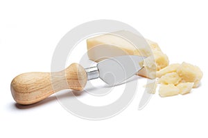 Pieces of Parmesan cheese and knife on white background