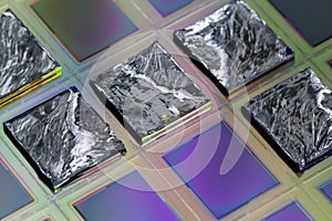 Pieces of polycrystalline silicon integrated on a polysilicon substrate with microchips photo