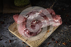 Pieces of pork tenderloin on a chopping board