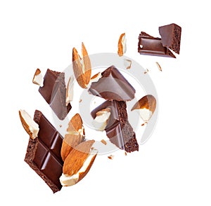 Pieces of porous chocolate with almonds close-up on white