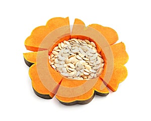 Pieces of pumpkin with seeds laid out in the shape of a flower