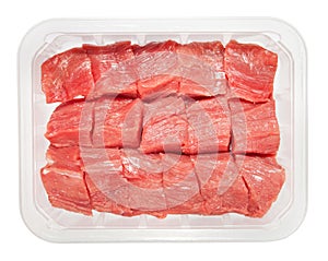 The pieces of raw meat in box isolated on white