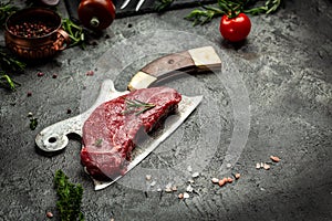 Pieces of raw rump steak with spices sserved on old meat butcher, Steak of marbled beef black Angus. Raw beef ramp steak, top view