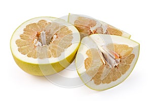 Pieces of ripe pomelo on a white background