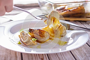 Pieces of roasted fennel on a white plate close-up