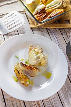 Pieces of roasted fennel on a white plate top view