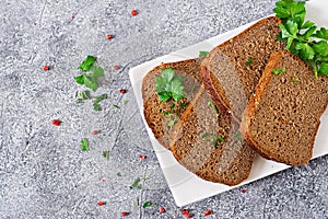 Pieces of rye bread on a plate. Top view