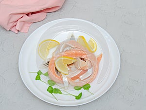 Pieces of salted salmon belly with lemon