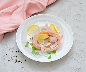 Pieces of salted salmon belly with lemon