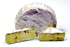 Pieces of sliced camembert cheese lying on the table