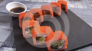 8 pieces of sushi on torrets and decoration, one will be taken away photo