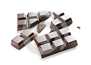 Pieces of tasty dark chocolate on white