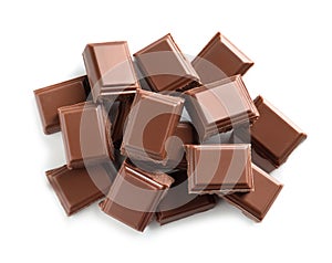 Pieces of tasty milk chocolate on white background