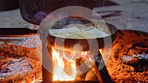 Pieces of tofu frying on pan in Sa Pa Valley