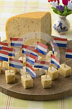 Pieces of traditional Dutch cumin cheese as a snack